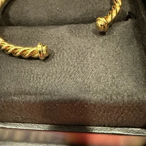 18m Gold Plated Twisted Bracelet with Simulated Diamond X Accents .
